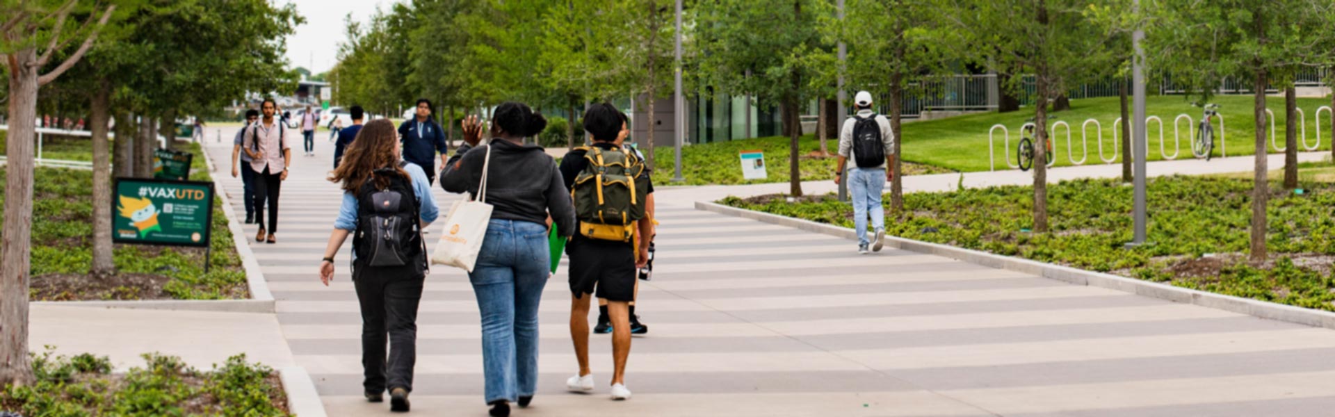 University of Texas at Dallas students walking to class on campus.